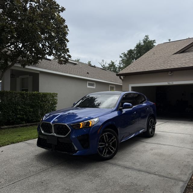 Ceramic window tint on a blue BMW SUV — Kissimmee, FL